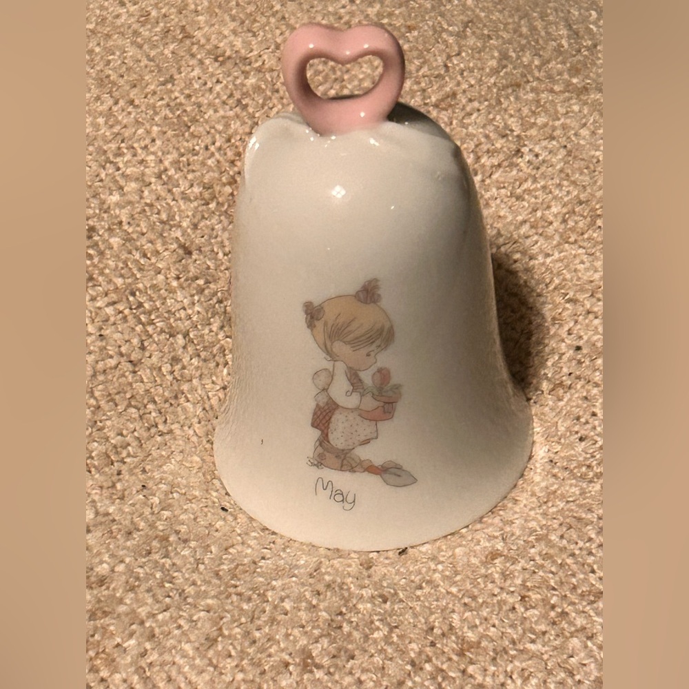 Precious Moments Birthday Bell for the month of May.
